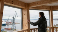 timber observation tower reinterprets kola bay’s industrial shoreline in russia