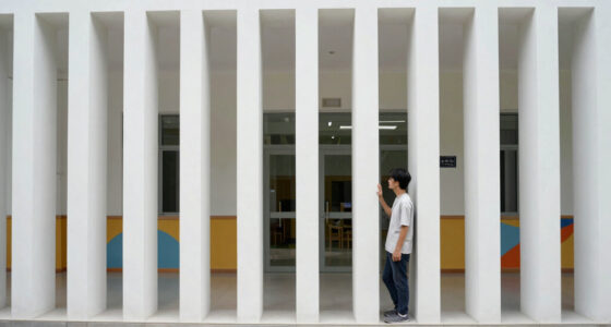 vertical white pillars compose rhythmic facade enfolding primary school in italy