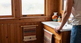 A Basically All-Wood Paneled '70s Bathroom Got an Americana Folk Makeover